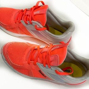 Women’s Reebok orange & white running shoe